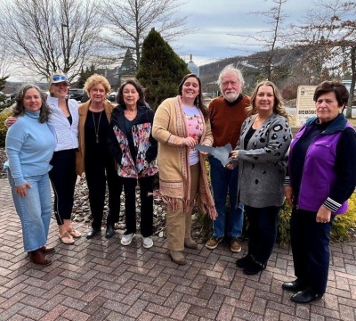 The Board of Directors for Reflection House gathered to celebrate signing their lease with Highland Park Dairy, LLC as their official location at 40 Dennett Road in Oakland. A grand opening will occur later this year after construction is finished. Commemorating this milestone are, from left, Barbara Friend, Vice President; Seth Anne Snider; Jan Russell, Treasurer; Vicki Thayer; Jaimie Bell, President; Tom Dabney; Suzette Merrick, Secretary and representative for Highland Park; and Ruth Beitzel.