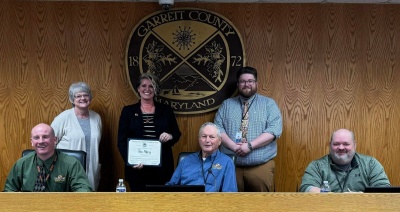 Photo (left to right):  Sitting: Commissioners Paul Edwards, Larry Tichnell, and Ryan Savage Standing: Business Development Manager Kim Durst, Tiffany Rains, Owner of The Alley, Business Development Specialist Connor Norman, and Director of Community Development Steve Kelley