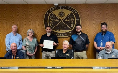 Photo (l-r): Sitting - Commissioners Paul Edwards, Larry Tichnell, and Ryan Savage. Standing - Garrett County Chamber President Andrew Fike, Business Development Manager Kim Durst, Beitzel Corporation CEO Shawn Bender, Chamber Membership Manager Nick Sharps, and Business Development Specialist Connor Norman