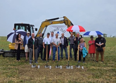 Brad Maust and Darren Schrock pose with dignitaries and community members for the groundbreaking of The North Hill Community, a senior housing development in Grantsville, MD.