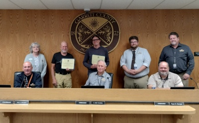 Photo (l-r): Sitting - Commissioners Paul Edwards, Larry Tichnell, and Ryan Savage. Standing - Business Development Manager Kim Durst, Roger Zbel and Warren Wik of Precision Rafting, Business Development Specialist Connor Norman, and Community Development Director Steve Kelley