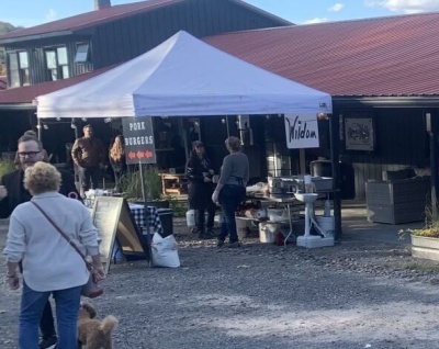 The Market on 42 celebrates its new businesses with an open house event with food, shops, and music. Pictured is Wildom Farm's Stand. Photo credit: Claire Sulllivan, The Republican Newspaper.