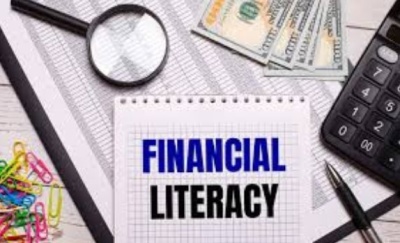 The words "Financial  Literacy" on a background of a collage of paper clips, money, magnifying glass, calculator, pens, and paper