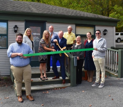 Ribbon cutting at Labcorp's new Patient Service Center in Oakland. Photo of men and women cutting the ribbon. Photo courtesy of Garrett County Chamber of Commerce.