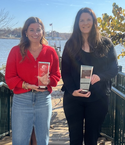 Ashli Workman from Allegany County and Sarah Duck from the Garrett County Chamber of Commerce accepted the Maryland Office of Tourism's Leveraging Partnerships Award for the counties' joint campaign - Make It. In The Mountains.