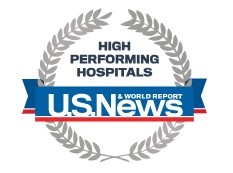 Logo: blue and red banner with the words High Performing Hospitals - U.S. News & World Report surrounded by a ring of silver leaves