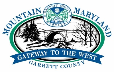 Logo: Mountain Maryland - Garrett County - Gateway to the West. Elliptical photo frame with a rendering of the Casselman Bridge in the center. Text in blue