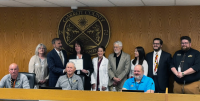Sitting l-r: Commissioners Paul Edwards, Larry Tichnell, and Ryan Savage. Standing l-r: Kim Durst - Manager of Business Development, Mark Boucot - President/CEO of GRMC; Kendra Thayer, GRMC; Marjorie Fridkin, M.D.; Thomas Johnson, M.D.; Emily Tobin - GRMC; Nick Sharps - GC Chamber of Commerce President; Connor Norman - Business Development Specialist
