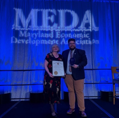 MEDA - Maryland Economic Development Association - Kim Durst and Connor Norman holding their awards