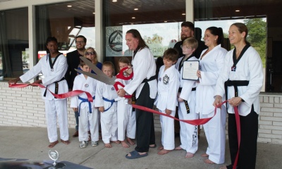 Officials from Garrett County Government and the Garrett County Chamber of Commerce are pictured with Master Dmitry Ostrogorsky and Oakland Martial Arts Academy students
