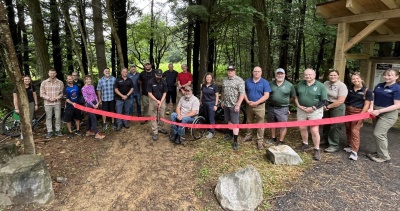 Maryland Department of Natural Resources Sec. Josh Kurtz cut the ribbon on the newly expanded 10-mile trail system in Garrett County on July 18.