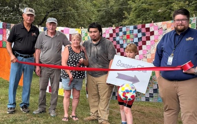 Photo (l-r): Commissioner Larry Tichnell, Roger Niner, Jane Niner, Jared Canfield, Kingston Collins, and Business Development Specialist Connor Norman. 