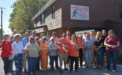 Men and women celebrating the ribbon cutting for Lake&Lure Country Store.