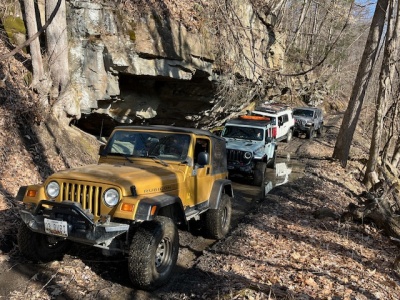 Four vehicles traverse an off-highway trail at Wolf Den Run State Park. Photo courtesy of Ken Kyler.