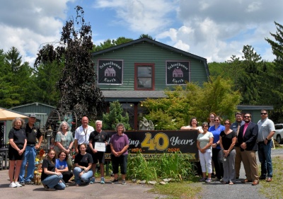 Photo: Schoolhouse Earth presented with 40th anniversary proclamation.