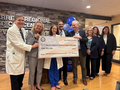 From left to right: Kevin Shannon, MD, oncologist at GRMC Cancer Center; U.S. Congresswoman April McClain Delaney; Marjorie Fridkin, MD, Chief Medical Officer of GRMC; Mark Boucot, president and CEO of GRMC; U.S. Senator Chris Van Hollen; Amy Boothe, COO/CFO, GRMC; Kendra Thayer, CNO/Vice President of Clinical Services, GRMC; and Delanie Blubaugh, representative from U.S. Senator Angela Alsobrooks office.