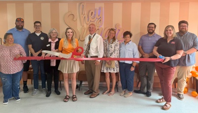 Photo of attendees at the ribbon cutting ceremony for Hey Sugar by Mullenax Bakery
