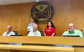 Brenda's Body Shop staff receiving a 45th anniversary proclamation from the Garrett County Commissioners