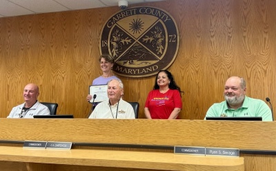 Brenda's Body Shop staff receiving a 45th anniversary proclamation from the Garrett County Commissioners