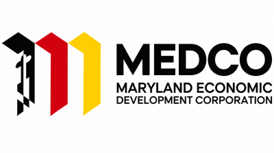 MEDCO (Maryland Economic Development Corporation) logo featuring a black, red, and yellow geometric emblem beside the organization’s name in bold black lettering on a white background.